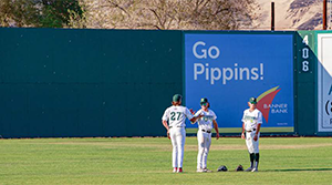 Pippins playing baseball in outfield