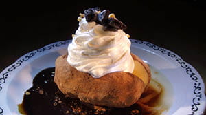 russet potato ice cream with whipped cream and cocoa powder
