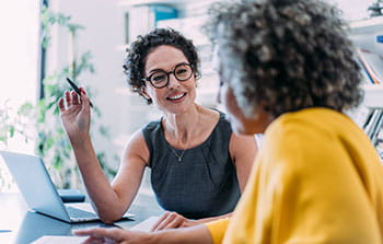 Two woman talking in an office
