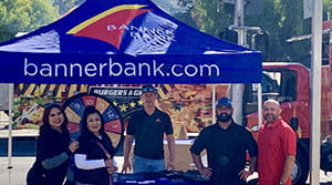 Banner Bank employees with a booth at the Sac Century Challenge
