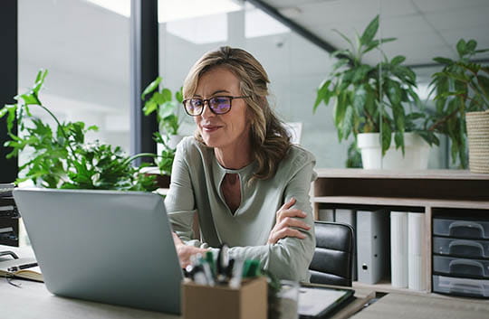person at laptop in office