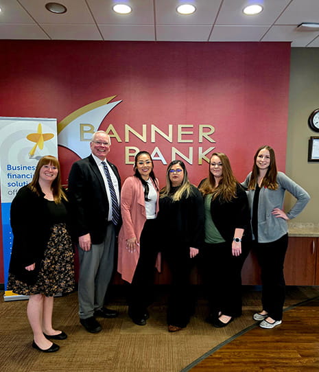 Ephrata team members in front of Banner Bank logo