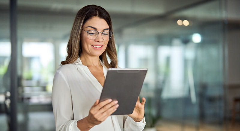Person holding and looking at a tablet