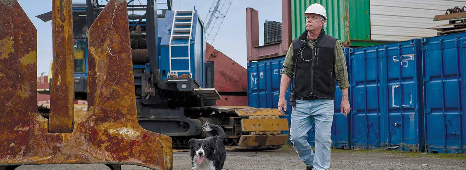 Man and dog leave construction site