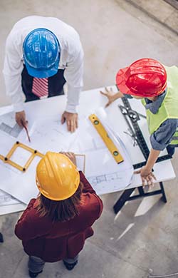 Contractors looking at paperwork