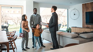 Realtor talking to family in a home