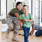 Military mom plays with kids