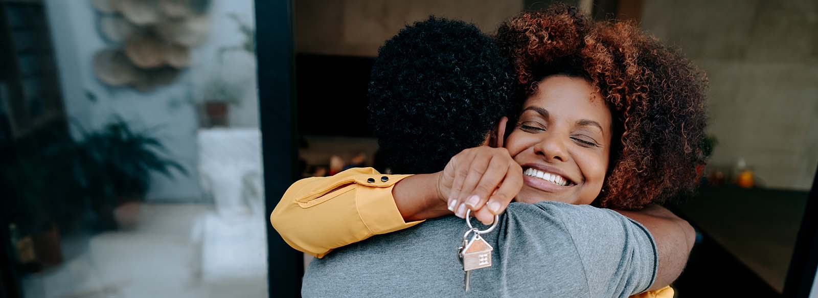 Couple looking inside a new home with a realtor