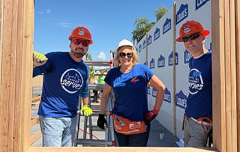 Banner employees framing a home with Habitat for Humanity