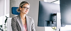 Person on a computer in an office space