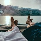 Couple relax on deck of cruise ship