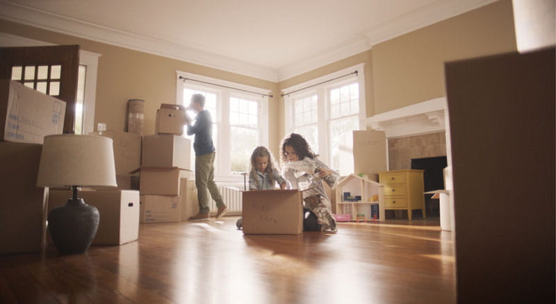 Family unpacks boxes in their new home thanks to a mortgage loan from Banner Bank