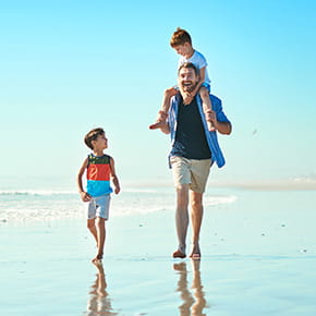 Rewards checking photo of family walking on beach